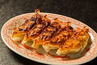 Guests making handmade gyoza at Sorisso in Tokyo