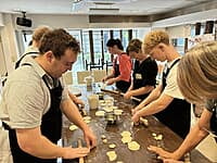 Guests making handmade gyoza at Sorisso in Tokyo