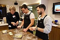 Guests making handmade gyoza at Sorisso in Tokyo