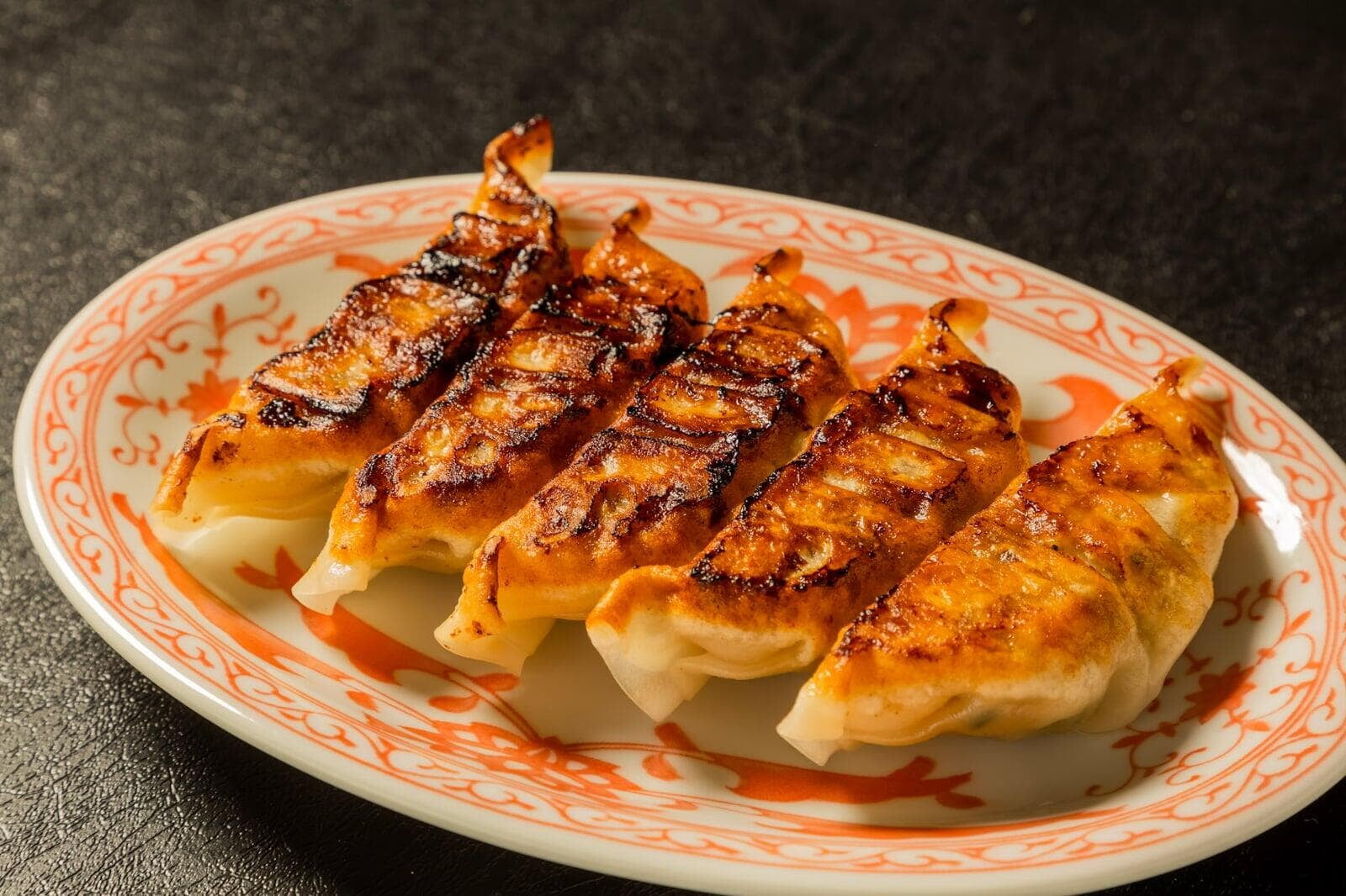 Guests making handmade gyoza at Sorisso in Tokyo